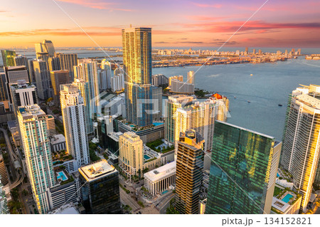 Urban cityscape of Miami Brickell downtown district in Florida, USA at sunset. Skyline with waterfront skyscraper buildings in modern American city Urban cityscape of Miami Brickell downtown district in Florida, USA at sunset. Skyline with waterfront skyscraper buildings in modern American city 134152821