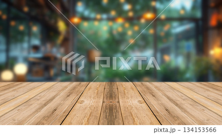 Wooden countertop in a cafe with blurred lights in the background, perfect for coffee or food display. Wooden countertop in a cafe with blurred lights in the background, perfect for coffee or food display. 134153566