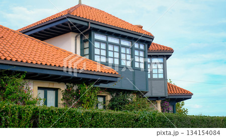 Beautiful traditional house in Northern Spain featuring a red terracotta tiled roof 134154084