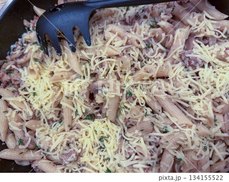 Creamy tuna pasta, Hearty pasta dish topped with cheese and herbs Creamy tuna pasta, Hearty pasta dish topped with cheese and herbs 134155522