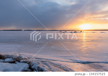 A tranquil winter scene of a frozen lake at sunset. Vyborg, Russia 134157525