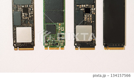 Four M.2 SSD boards top view with copy space on white background 134157566