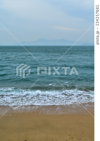 Close-up of soft waves sand beach and blue sea. Texture of water, white foam waves. Seascape, Sea background, Sea water with copy space, summer vacation concept. Close-up of soft waves sand beach and blue sea. Texture of water, white foam waves. Seascape, Sea background, Sea water with copy space, summer vacation concept. 134157681