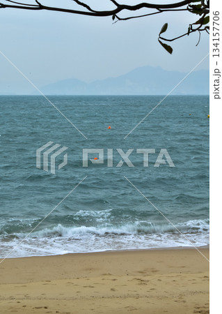 Close-up of soft waves sand beach and blue sea. Texture of water, white foam waves. Seascape, Sea background, Sea water with copy space, summer vacation concept. Close-up of soft waves sand beach and blue sea. Texture of water, white foam waves. Seascape, Sea background, Sea water with copy space, summer vacation concept. 134157706