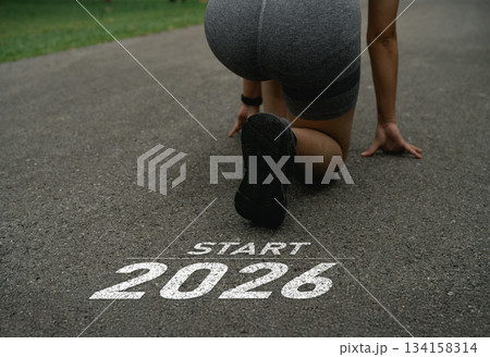 Happy new year 2026, Athlete Preparing for a New Beginning in 2026 on an Outdoor Track with Innovative Fitness Ideas and Goals for a Healthier Lifestyle 134158314