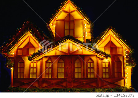 Wooden festive layout,decoration.Night glowing lighting decoration house Wooden festive layout,decoration.Night glowing lighting decoration house 134158375