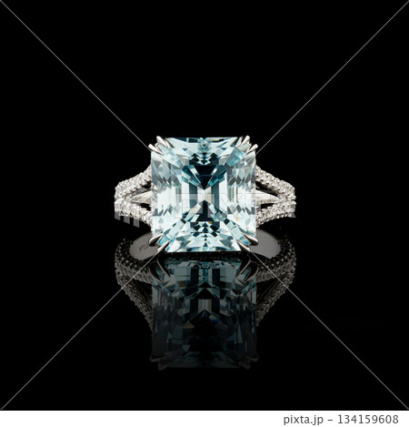 Beautiful white gold ring with diamonds and aquamarine on a black background 134159608