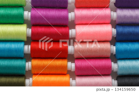 Set of colorful spools of thread 134159650
