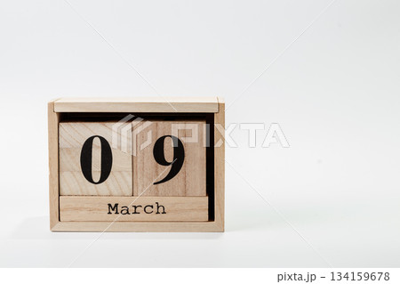 Wooden calendar March 09 on a white background 134159678