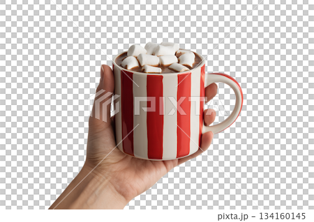 Hand holding warm, striped ceramic mug filled with hot chocolate and topped with fluffy marshmallows, cozy comfort drink 134160145