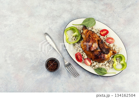 Half grilled chicken on the grill, menu. 134162504