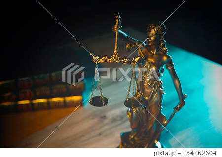 Lady Justice figurine on table. Law and justice Lady Justice figurine on table. Law and justice 134162604
