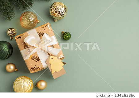 Border fron Christmas Gifts with Ornaments and Evergreen Branches on Festive Background Border fron Christmas Gifts with Ornaments and Evergreen Branches on Festive Background 134162866