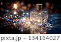 Luxurious perfume bottle amid sparkling lights 134164027