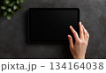 Hand touching blank tablet screen 134164038
