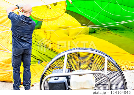 Preparing a hot air balloon to start the flight, heated by hot air	 134164046