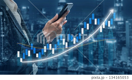 Businessman Holding Smartphone with Financial Graphs Overlaid on Cityscape, Representing Investment Growth and Market Analysis in a Digital Era Copula 134165053