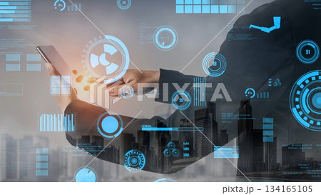 Business professional using smartphone to interact with futuristic data visualization technology in a modern urban landscape xenic Business professional using smartphone to interact with futuristic data visualization technology in a modern urban landscape xenic 134165105