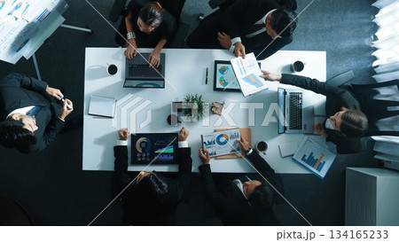 Top view of smart manager standing and present marketing plan. Directorate. Top view of smart manager standing and present marketing plan. Directorate. 134165233