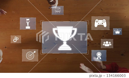 Group Collaboration with Achievement Icons Illustrating Success, Gaming, Teamwork, and Awards on a Wooden Table Background. Raster Group Collaboration with Achievement Icons Illustrating Success, Gaming, Teamwork, and Awards on a Wooden Table Background. Raster 134166003
