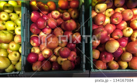 Market Display Features Fresh Apples in Containers During the Autumn Harvest Season 134167084