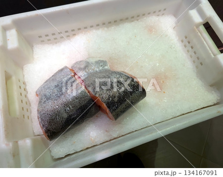 Chilled Pieces of Fish on Ice in a Clean Container at a Seafood Market in the Morning Chilled Pieces of Fish on Ice in a Clean Container at a Seafood Market in the Morning 134167091