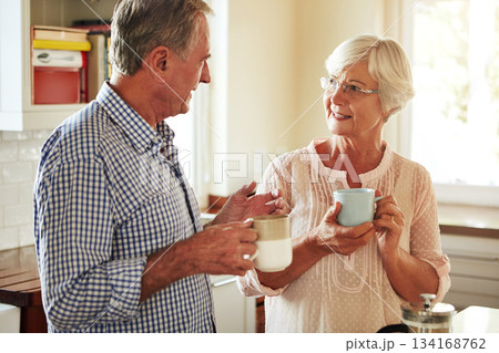 Chat, coffee or old couple talking in kitchen at home bonding or enjoying quality morning time together. Happy, retirement or senior man speaking, relaxing or drinking tea espresso with woman at home Chat, coffee or old couple talking in kitchen at home bonding or enjoying quality morning time together. Happy, retirement or senior man speaking, relaxing or drinking tea espresso with woman at home 134168762