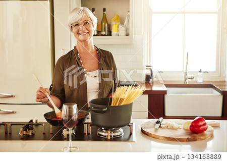 Portrait, cooking or senior woman in kitchen with healthy food for nutrition, wellness or retirement at home. Elderly, spaghetti or mature person in house kitchen in preparation for dinner meal Portrait, cooking or senior woman in kitchen with healthy food for nutrition, wellness or retirement at home. Elderly, spaghetti or mature person in house kitchen in preparation for dinner meal 134168889