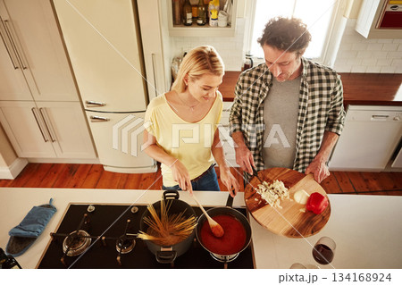 Top view, food or couple in the kitchen cooking with healthy vegetables for lunch meal or dinner together. Love or woman helping or talking to mature husband in meal preparation in Sydney, Australia Top view, food or couple in the kitchen cooking with healthy vegetables for lunch meal or dinner together. Love or woman helping or talking to mature husband in meal preparation in Sydney, Australia 134168924