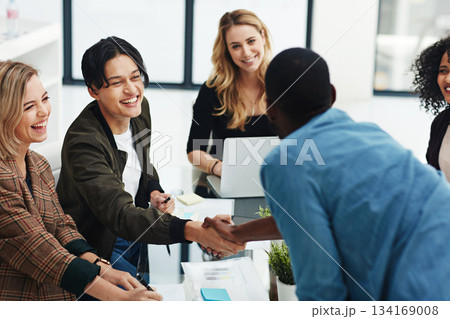 Teamwork, handshake and business people in meeting for collaboration, planning and thank you. Marketing agency, diversity and men and women shaking hands for success, agreement and deal in office 134169008