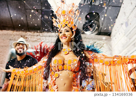Samba, music and dance with woman at carnival for celebration, party and festival in Rio de Janeiro. Confetti, show and creative with brazil girl for performance, new year and culture event 134169336