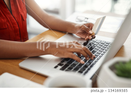 Payment, credit card and woman at laptop for online shopping, e-commerce or internet store. Closeup of female entrepreneur at desk with keyboard for banking, booking or fintech website for business Payment, credit card and woman at laptop for online shopping, e-commerce or internet store. Closeup of female entrepreneur at desk with keyboard for banking, booking or fintech website for business 134169385