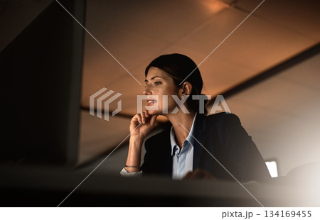 Thinking, overtime and focus, woman in office reading email or online report idea at start up agency. Corporate night work, challenge and businesswoman at desk working late on computer for job ideas. 134169455