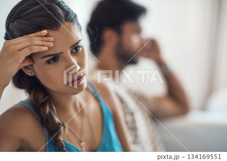 Unhappy, upset or sad with a couple arguing on a sofa in their home living room about an affair or breakup. Depression, abuse or domestic violence with a woman thinking about divorce after a fight Unhappy, upset or sad with a couple arguing on a sofa in their home living room about an affair or breakup. Depression, abuse or domestic violence with a woman thinking about divorce after a fight 134169551