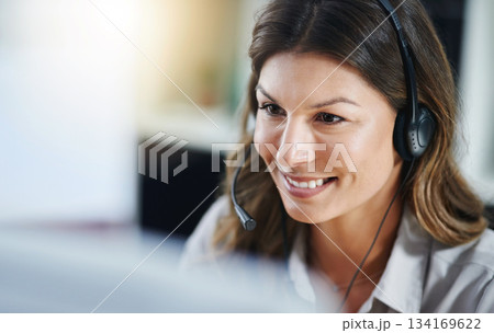 Communication, face or friendly woman in call center consulting, speaking or talking at customer services. Virtual assistant, happy or sales consultant in telemarketing or telecom company help desk 134169622