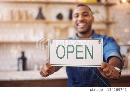 Closeup of open sign, man and owner of shop, store and advertising notice of retail trading time, services and information. Hands of happy cafe worker with opening banner, welcome and startup poster 134169741