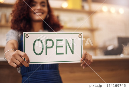 Open sign, hands and woman advertising in store, shop and notice of retail shopping time, board or trading information. Closeup, small business owner and opening banner for welcome, start or services 134169746