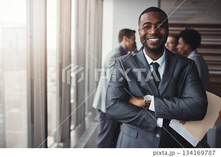 Black man in business, arms crossed with smile in portrait and leadership, corporate lawyer in meeting. Businessman in conference room, happy male person with confidence in company and management Black man in business, arms crossed with smile in portrait and leadership, corporate lawyer in meeting. Businessman in conference room, happy male person with confidence in company and management 134169787