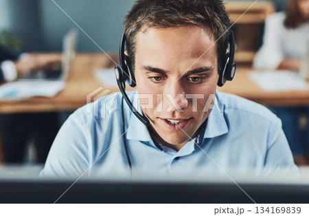 Businessman, call center and consulting with headphones on computer in customer service, support or telemarketing at office. Man consultant agent talking on PC for online advice or help in contact us 134169839