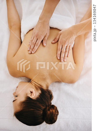 Back, beauty and massage with woman in spa for wellness, luxury and cosmetics treatment from above. Skincare, peace and zen with female customer and hands of therapist for therapy, salon and detox Back, beauty and massage with woman in spa for wellness, luxury and cosmetics treatment from above. Skincare, peace and zen with female customer and hands of therapist for therapy, salon and detox 134169847