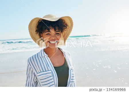 Woman, face portrait and summer at the beach for a vacation, travel or holiday with a smile. African female person at sea with happiness, freedom and positive mindset to relax outdoor Woman, face portrait and summer at the beach for a vacation, travel or holiday with a smile. African female person at sea with happiness, freedom and positive mindset to relax outdoor 134169966