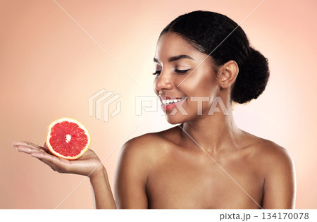 Grapefruit, natural beauty and happy woman in studio, background and sustainable mockup. African model, healthy skincare and citrus fruits for cosmetics, organic dermatology and vitamin c benefits 134170078