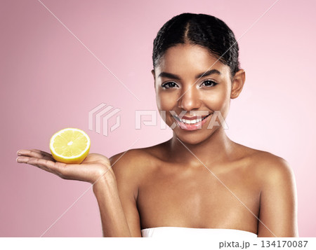 Lemon fruit, skincare and portrait of happy woman in studio mockup, pink background and vitamin c benefits. Face of african model, citrus and natural beauty for cosmetics, vegan dermatology and shine Lemon fruit, skincare and portrait of happy woman in studio mockup, pink background and vitamin c benefits. Face of african model, citrus and natural beauty for cosmetics, vegan dermatology and shine 134170087
