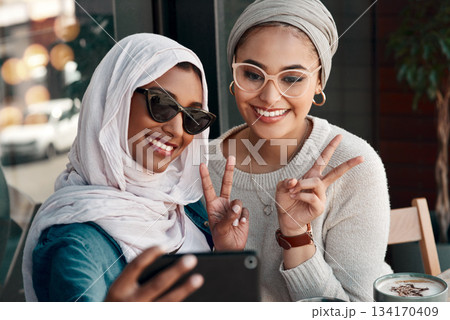 Selfie, muslim women and friends with peace sign in city for social media, influencer content creation or fashion blog. Happy gen z people in Saudi Arabia, emoji profile picture or online photography Selfie, muslim women and friends with peace sign in city for social media, influencer content creation or fashion blog. Happy gen z people in Saudi Arabia, emoji profile picture or online photography 134170409