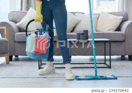 Bucket, mop and person with product for cleaning, housework and chores in a house. Start, lifestyle and a cleaner with tools to clean the living room, mopping and apartment hygiene in a home 134170642