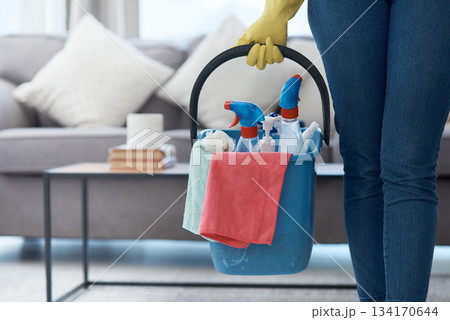 Chores, product and hands with a bucket for cleaning, cleaner lifestyle and home routine. Housework, apartment and person holding equipment to clean a house for housekeeping and hygiene in the lounge 134170644