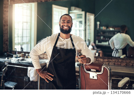 Barber shop, hair clipper and black man portrait of an entrepreneur with a smile. Salon, professional worker and male person face with happiness and proud from small business and beauty parlor Barber shop, hair clipper and black man portrait of an entrepreneur with a smile. Salon, professional worker and male person face with happiness and proud from small business and beauty parlor 134170666