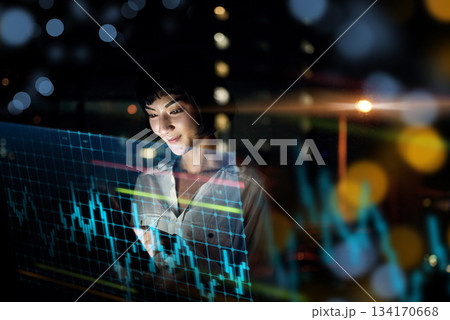 Business woman, tablet and dashboard at night of stock market, trading or graph and chart data at office. Female trader or broker working late on technology checking trends, analytics or statistics Business woman, tablet and dashboard at night of stock market, trading or graph and chart data at office. Female trader or broker working late on technology checking trends, analytics or statistics 134170668
