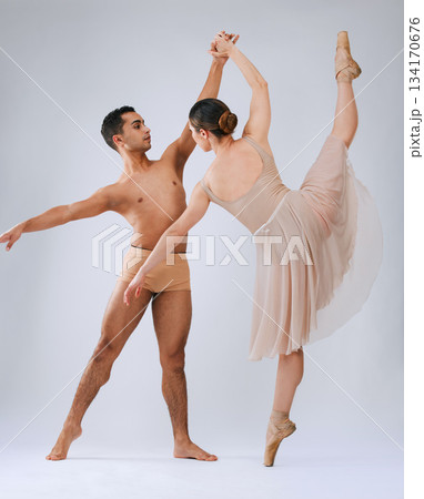 Ballet dancing couple, studio and holding hands for balance, finesse and art movement for beauty in class. Young dancer team, performance or man with woman in class for fitness, teamwork and focus Ballet dancing couple, studio and holding hands for balance, finesse and art movement for beauty in class. Young dancer team, performance or man with woman in class for fitness, teamwork and focus 134170676