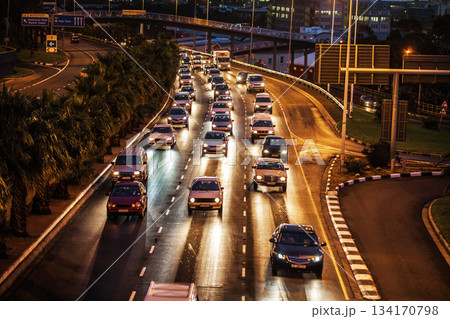 Traffic jam, highway and street in night for driving, transportation or travel in rush hour. Busy urban road, cars and journey in Cape Town metro with congestion, infrastructure network and cityscape 134170798